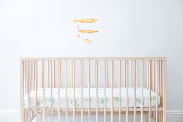 fitted crib sheet - leafy sea dragon green